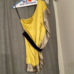 Women’s Bebe, one armed, gold silk dress with black belt, size XXS